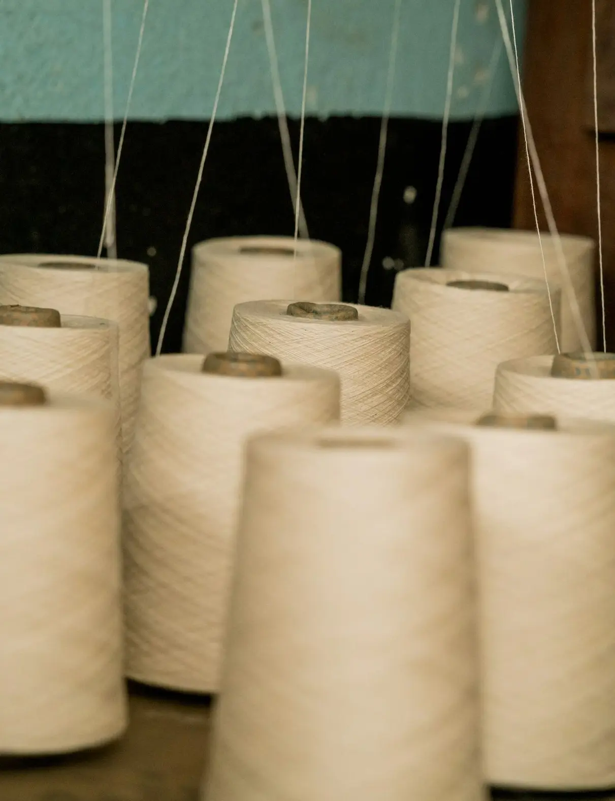 selective focus photography of white threads